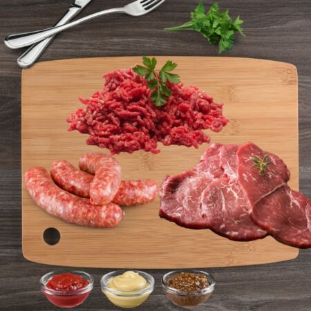 BBQ Pack displays Mince Beef Sausages Steak on chopping board with condiments