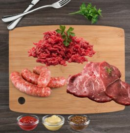 BBQ Pack displays Mince Beef Sausages Steak on chopping board with condiments